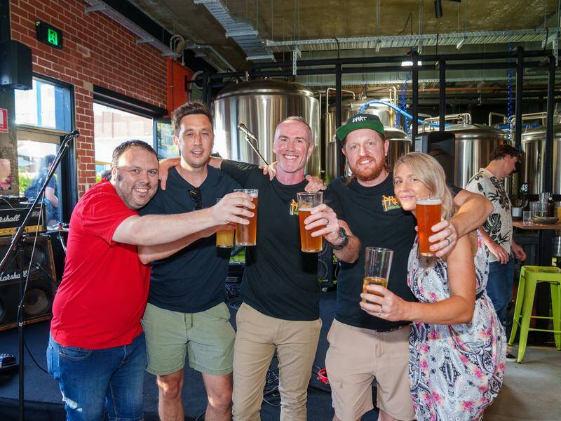 Travis Moore (second from right) says big boys Lion and Carlton are forcing small brewers out. Photo: HANDOUT/PHAT BREW CLUB