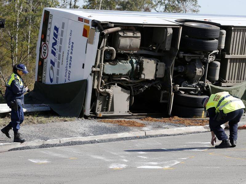 The driver of the bus that crashed after a wedding, killing 10 people, has been charged. (Darren Pateman/AAP PHOTOS)