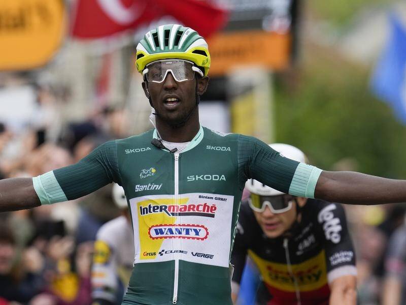Eritrea's Biniam Girmay celebrates as he wins the eighth stage of the Tour de France. (AP PHOTO)