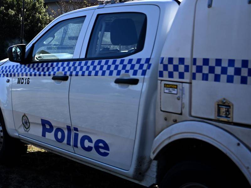 Officers say three police cars were damaged after one of their vehicles was stolen. (Bianca De Marchi/AAP PHOTOS)