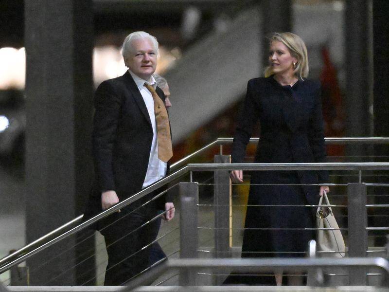 WikiLeaks founder Julian Assange returned to Australia flanked by his lawyer Jennifer Robinson. (Mick Tsikas/AAP PHOTOS)