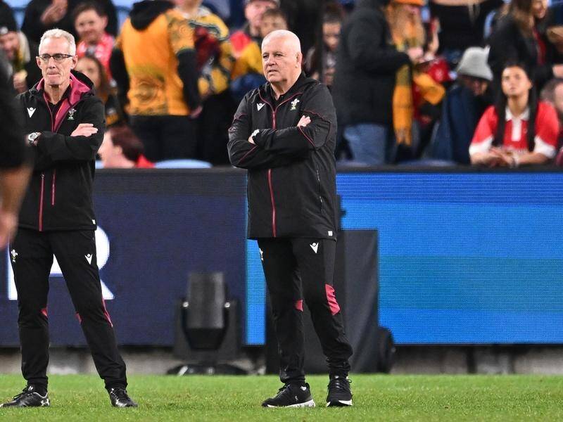 Wales head coach Warren Gatland (R) alongside assistant Rob Howley watch their side lose in Sydney. (James Gourley/AAP PHOTOS)