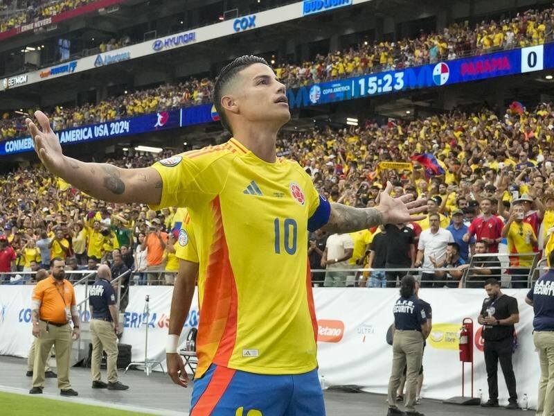Colombia's James Rodriguez celebrates his goal in a 5-0 hammering of Panama at the Copa America. (AP PHOTO)