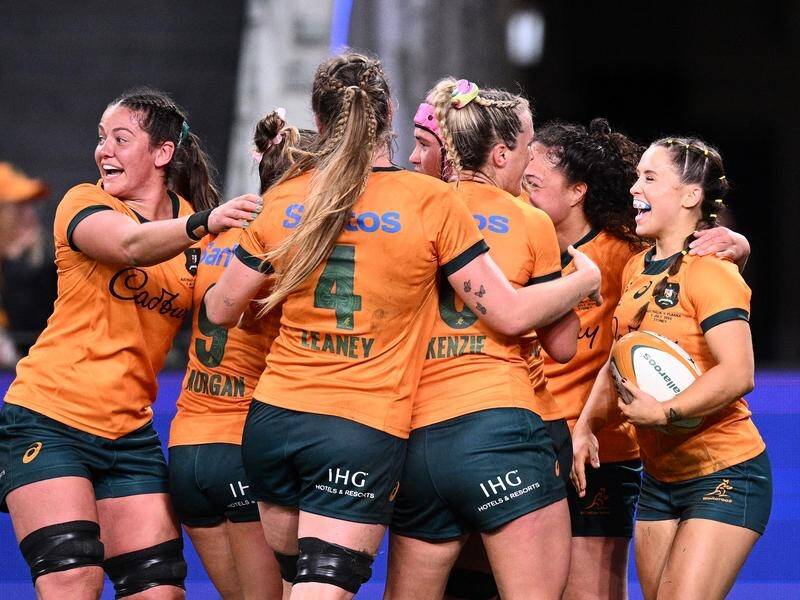 Desiree Miller (right) has scored four tries as the Wallaroos romped to a 64-5 win over Fiji. (Dan Himbrechts/AAP PHOTOS)
