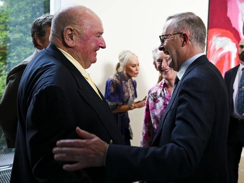 Anthony Albanese is under fire over a private meeting with billionaire Lindsay Fox, left. (Lukas Coch/AAP PHOTOS)