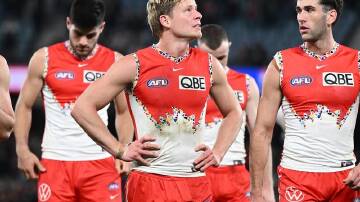 Isaac Heeney (centre) will be ineligible for the Brownlow Medal unless he overturns a one match ban. (Joel Carrett/AAP PHOTOS)