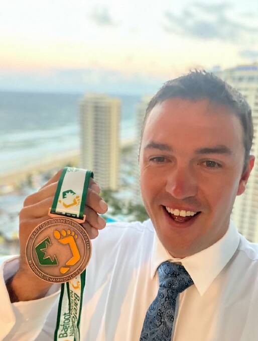 Trent McEachen with his bronze medal in the tricks event of the Australian National Barefoot Water-skiing Championships. Picture supplied. 