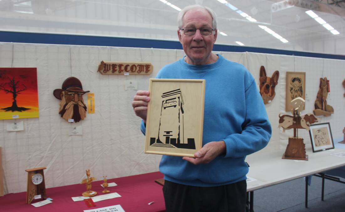 Bob Buxton with his scroll saw of Rocky Hill. Photo: Burney Wong. 