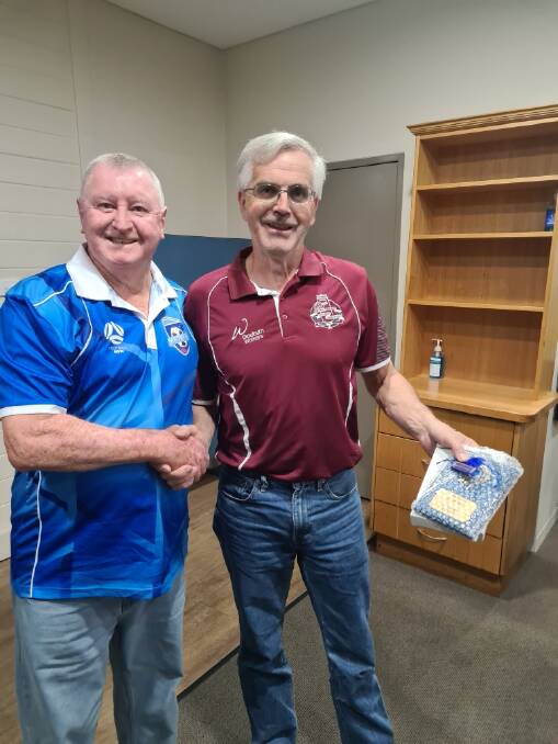 Robert Scott (right) receiving his life membership. Picture supplied. 