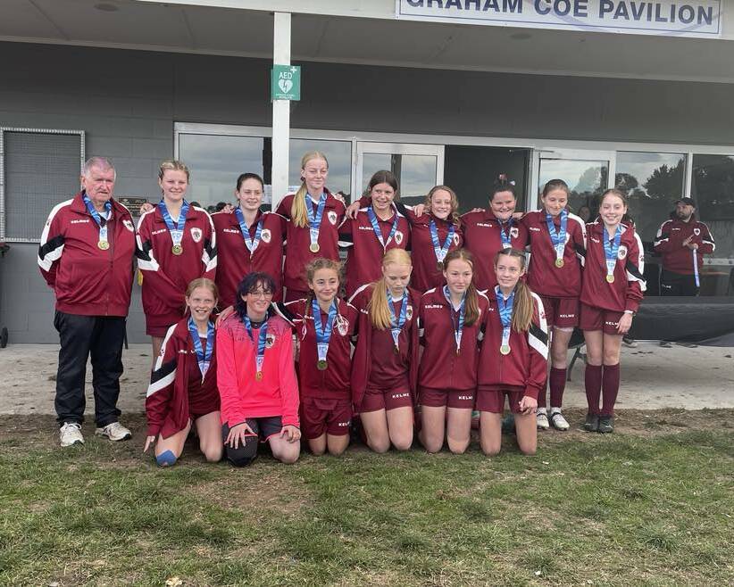 The Southern Tablelands u14 girls with their medals following their victory. Picture by Burney Wong. 
