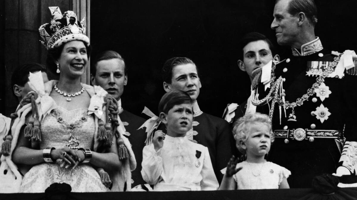 Queen Elizabeth II on the balcony of Buckingham Palace after her 1953 coronation with, from left, Prince Charles, Princess Anne and Prince Philip, Duke of Edinburgh. Picture by Getty Images