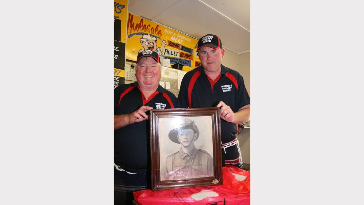 Local butchers, Bill Murray and son Shane proudly display their great uncle’s portrait in their Union St shop.